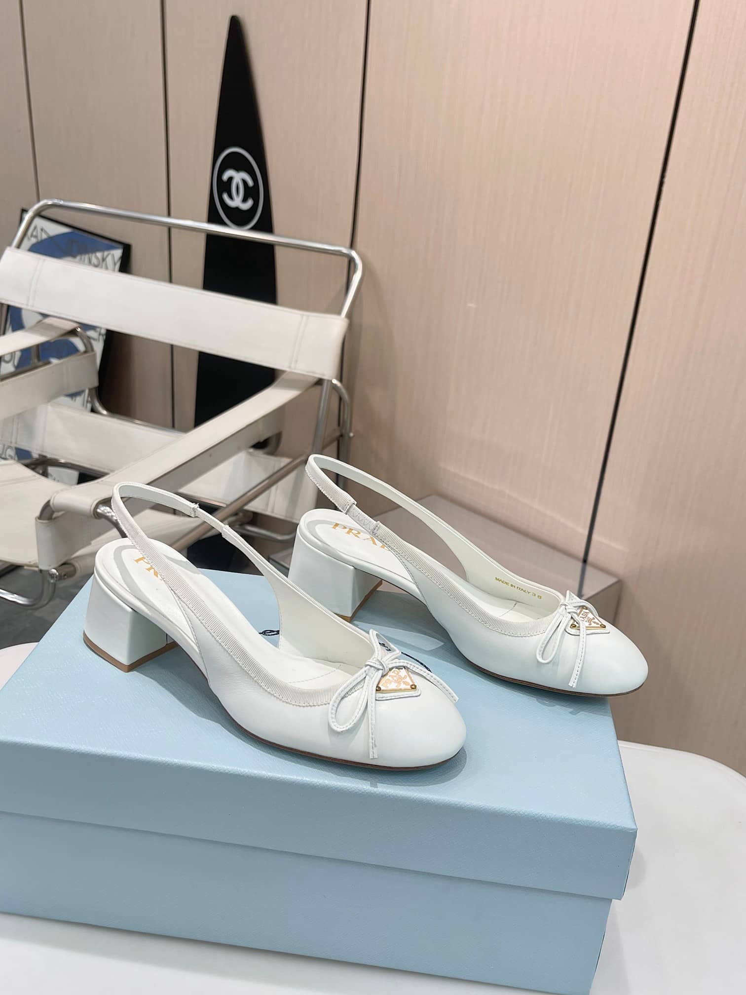 Prada Triangle Logo Bow Slingback Pump In White