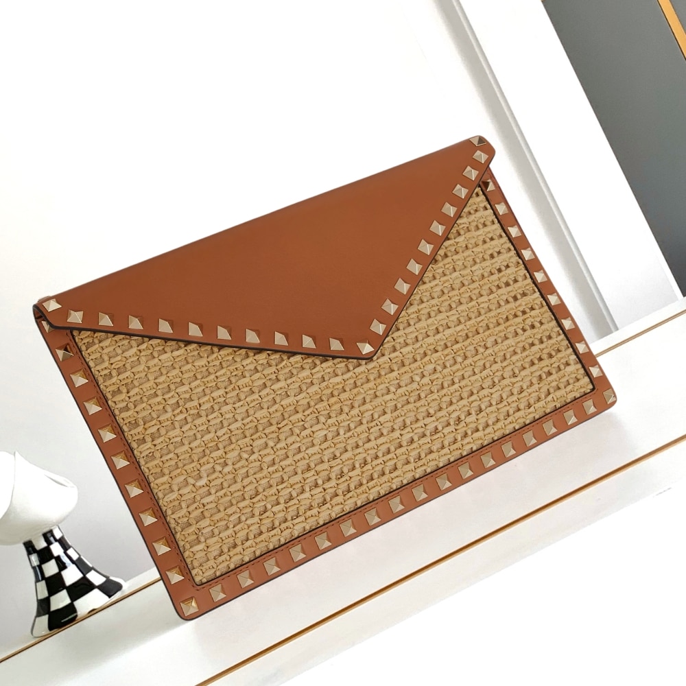 Valentino Garavani Rockstud Raffia Clutch Bag In Brown 28cm