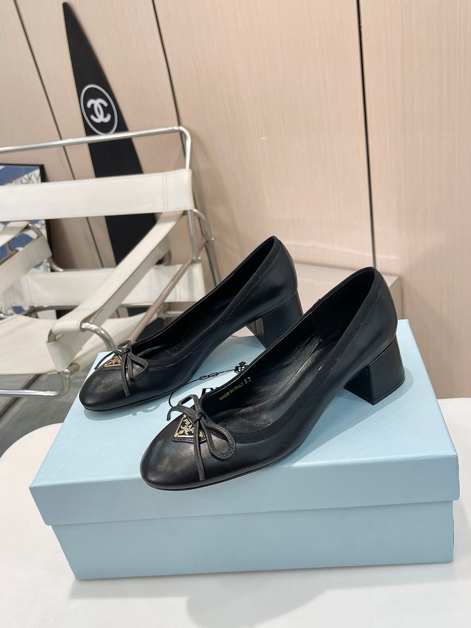 Prada Triangle Logo Bow Pump In Black