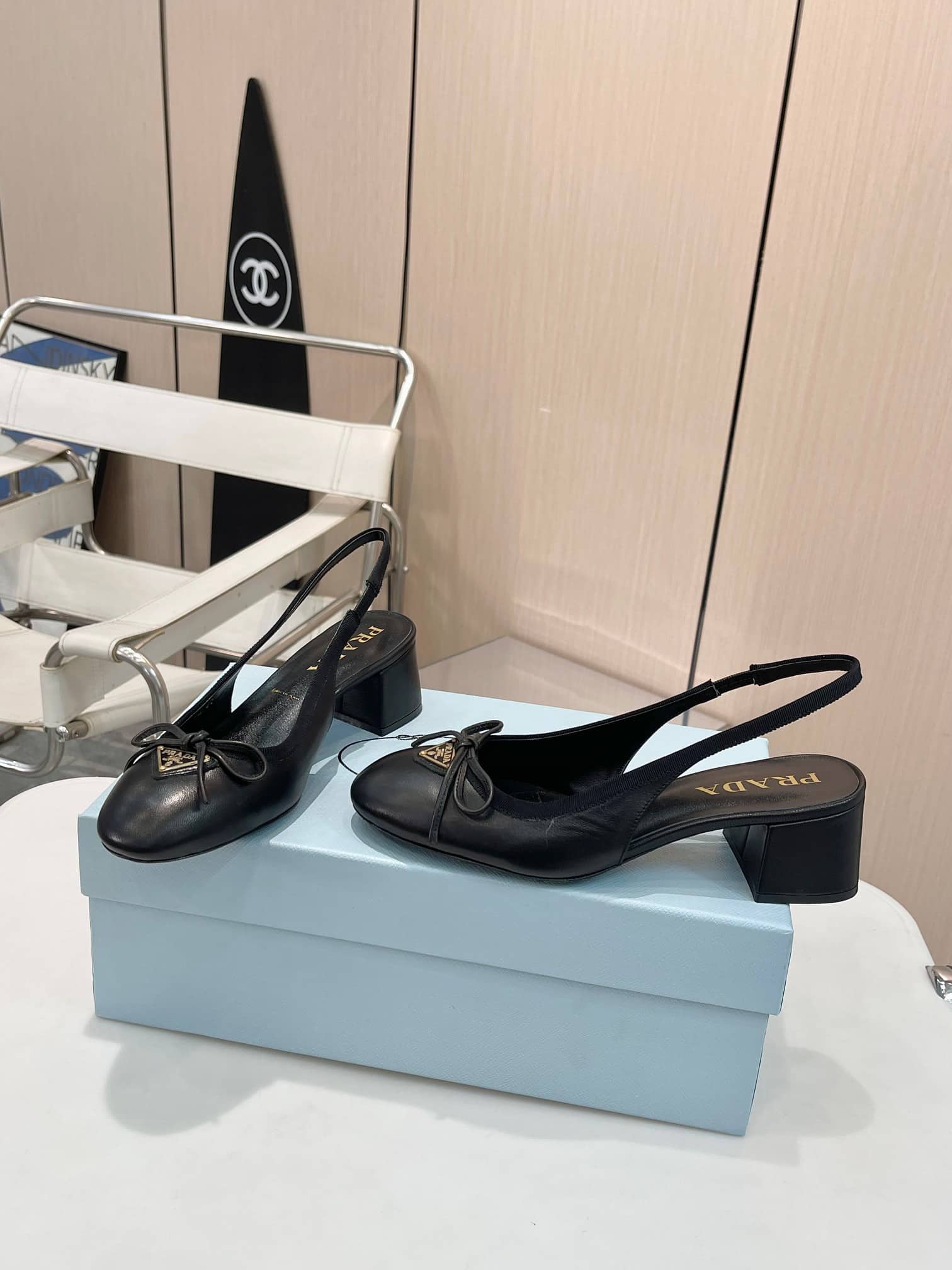 Prada Triangle Logo Bow Slingback Pump In Black