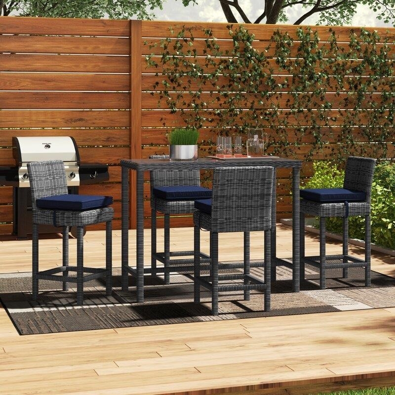 Keiran Rectangular 4 - Person 52'' Long Bar Height Dining Set with Cushions
