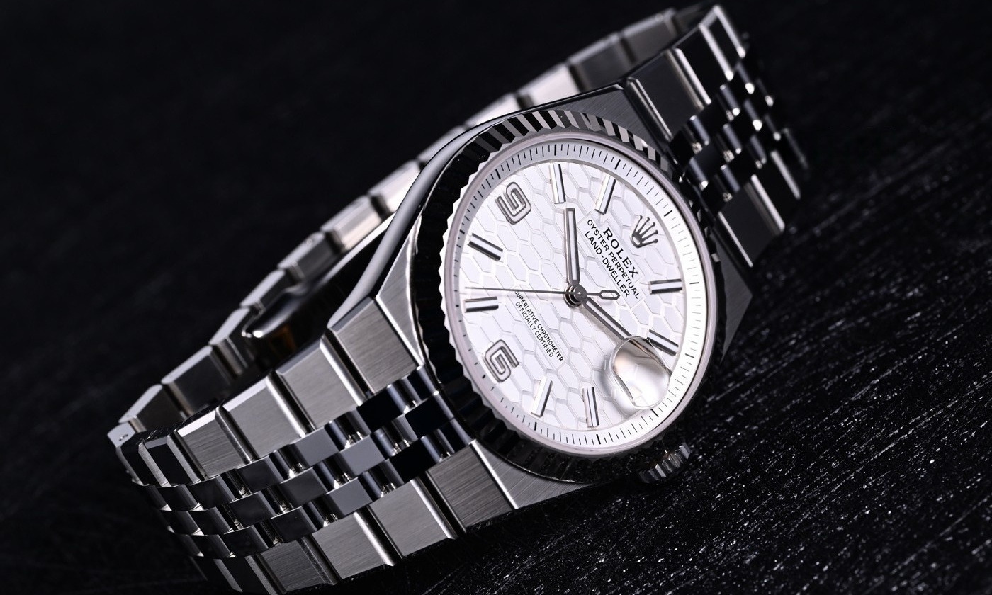 Rolex Land Dweller white dial luxury sports watch front view
