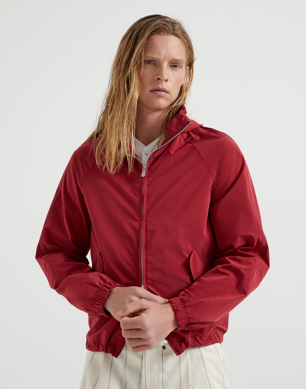 Water-resistant microfiber unlined outerwear jacket with packable hood and heat-bonded seams