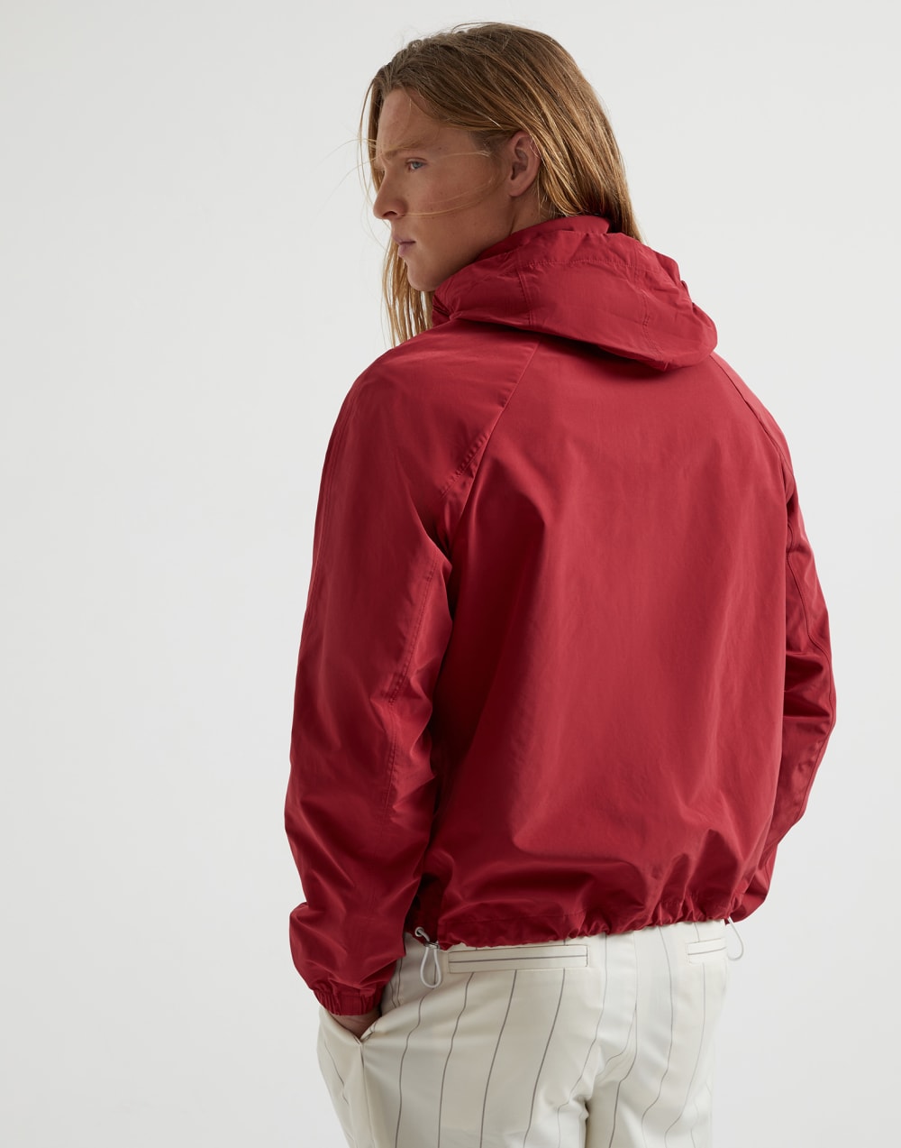 Water-resistant microfiber unlined outerwear jacket with packable hood and heat-bonded seams