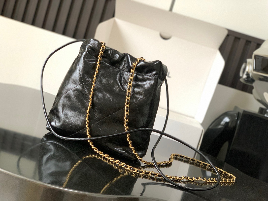 CHANEL CHANEL 22 Mini Handbag Shiny Calfskin, Imitation Pearls & Gold-Tone Metal Black- AS3980