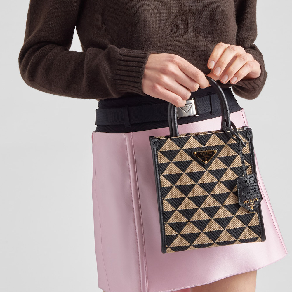 Symbole embroidered fabric mini bag