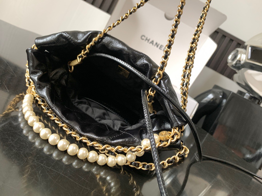 CHANEL CHANEL 22 Mini Handbag Shiny Calfskin, Imitation Pearls & Gold-Tone Metal Black- AS3980