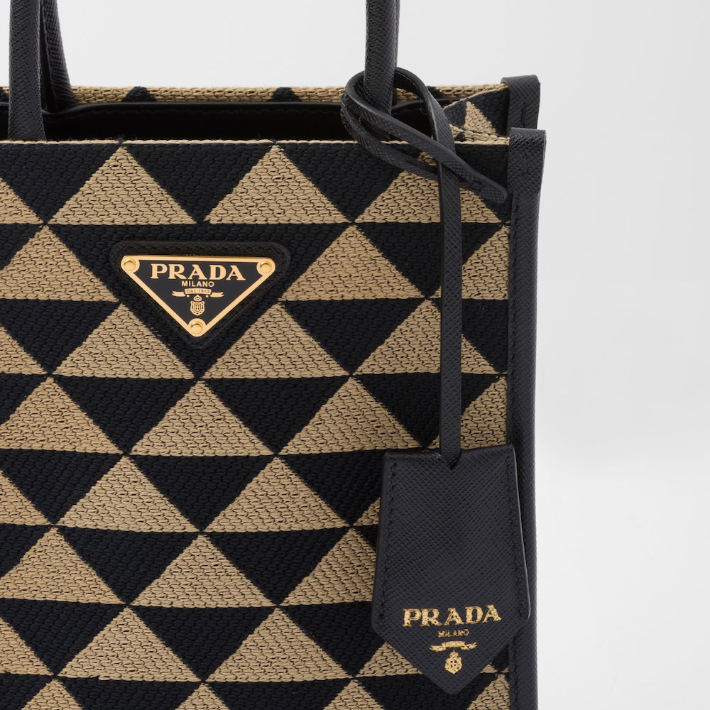 Symbole embroidered fabric mini bag