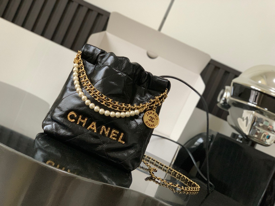 CHANEL CHANEL 22 Mini Handbag Shiny Calfskin, Imitation Pearls & Gold-Tone Metal Black- AS3980