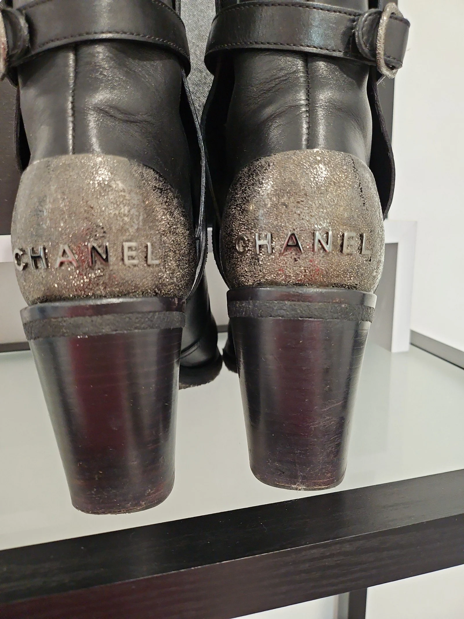 Chanel metal plaque runway boots