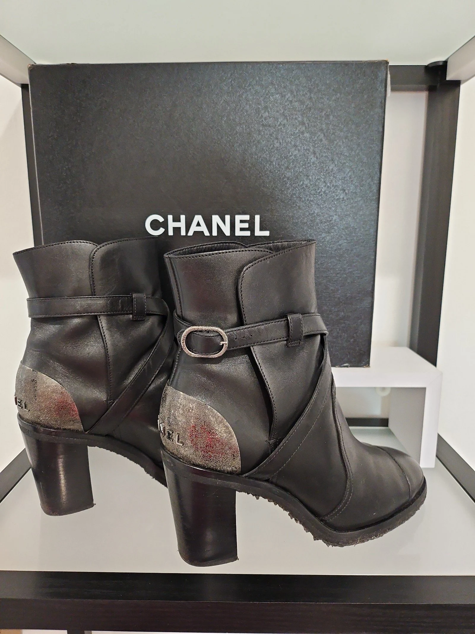 Chanel metal plaque runway boots