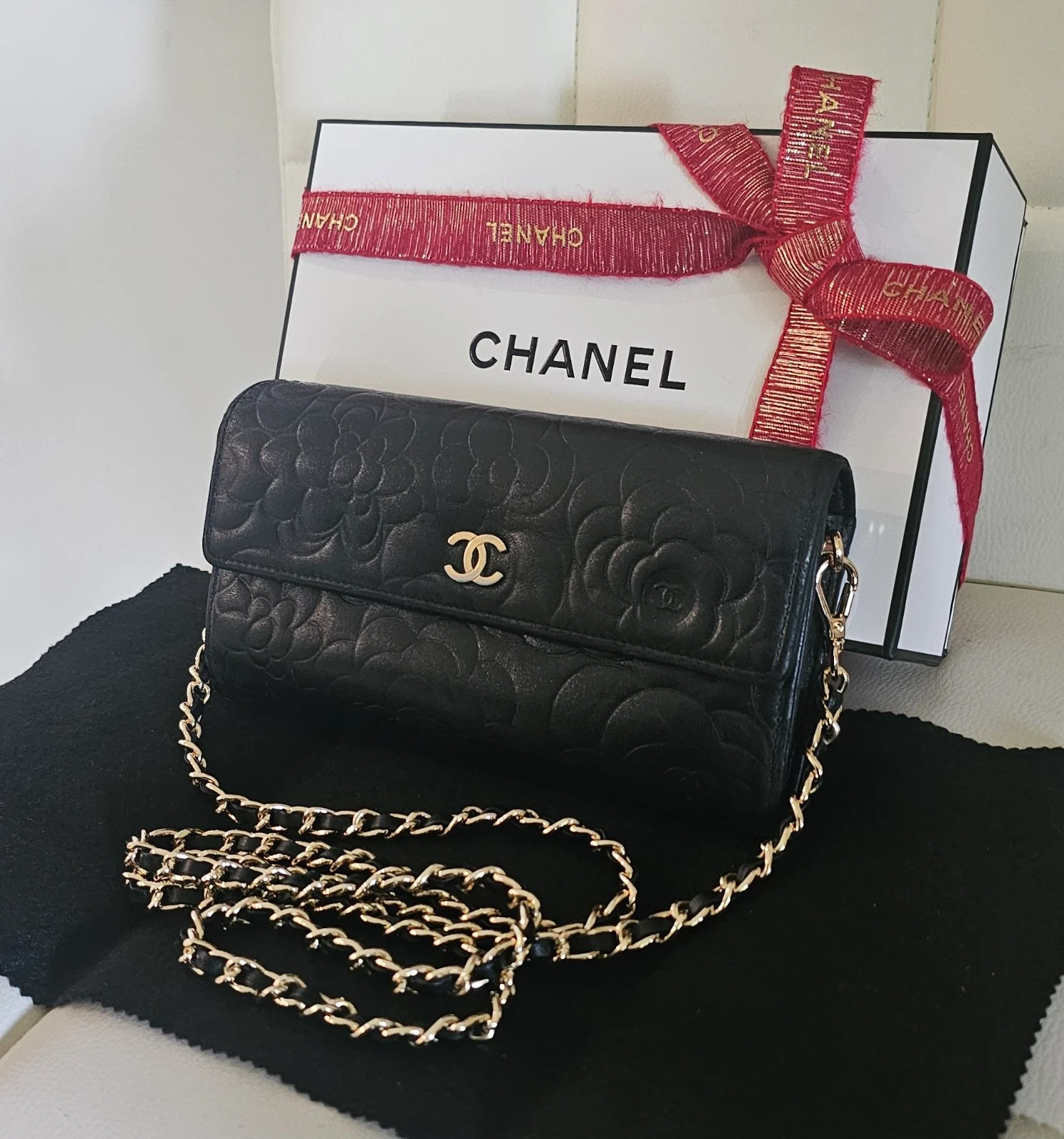 CHANEL Black Lambskin Camellia Embossed Wallet