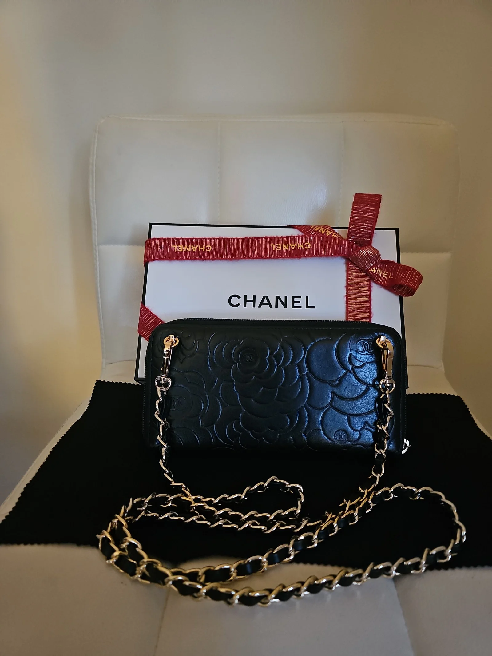 CHANEL Black Lambskin Camellia Embossed Zip Around Wallet