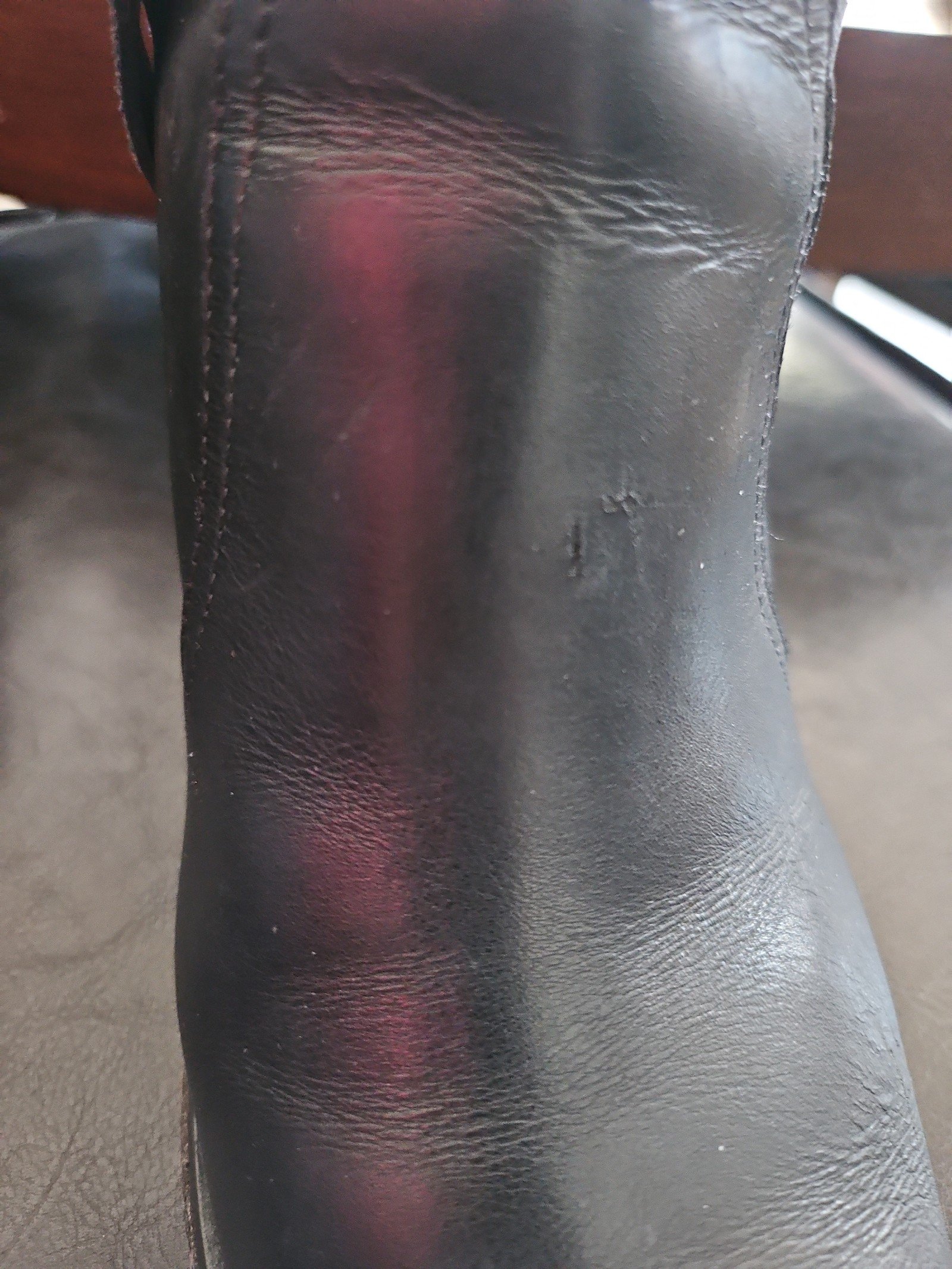 Chanel metal plaque runway boots