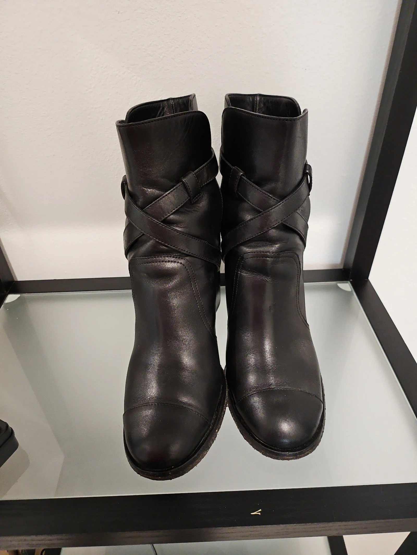 Chanel metal plaque runway boots