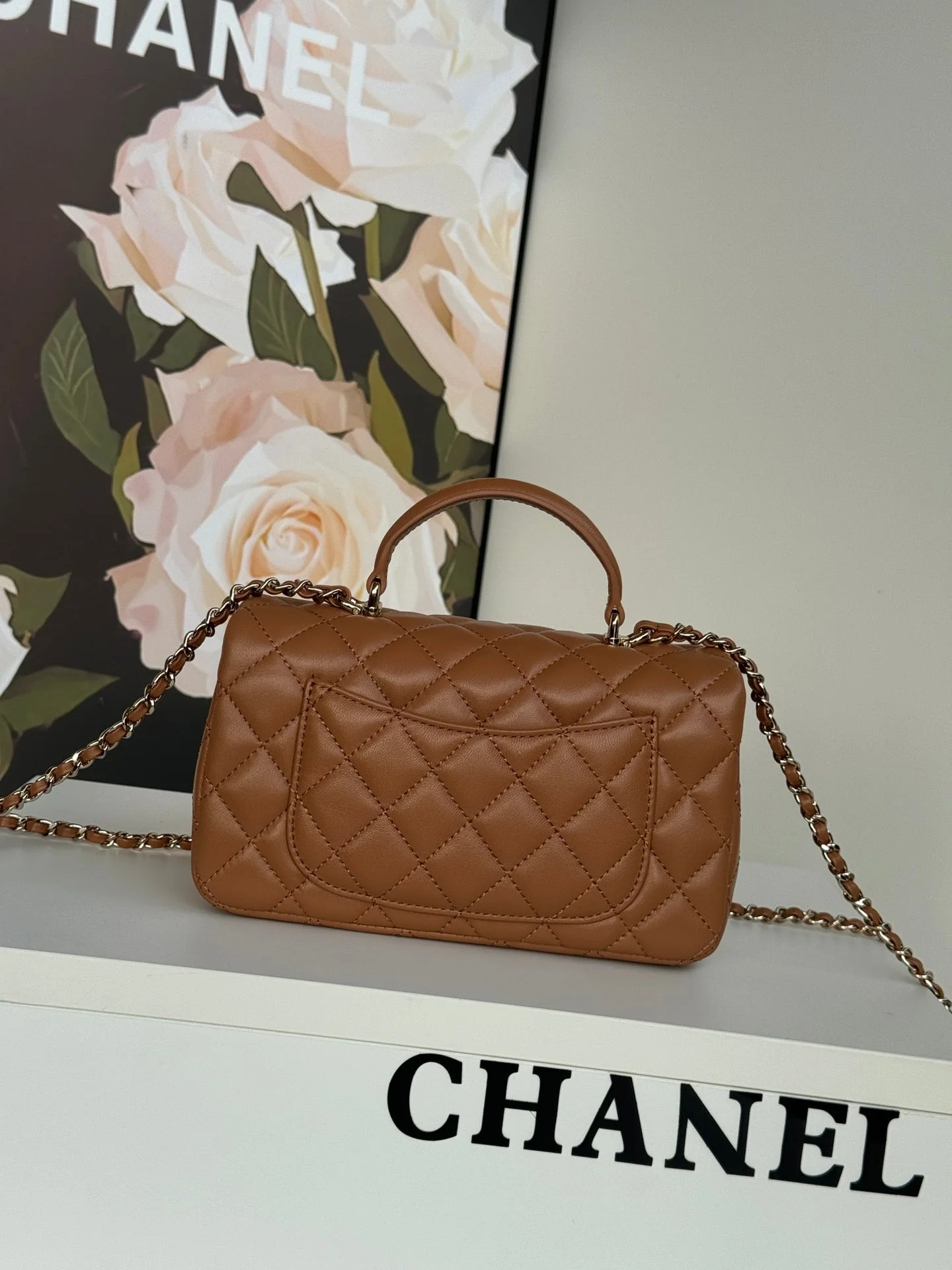 FLAP BAG 20 IN BRONZE BROWN LAMBSKIN WITH HANDLE