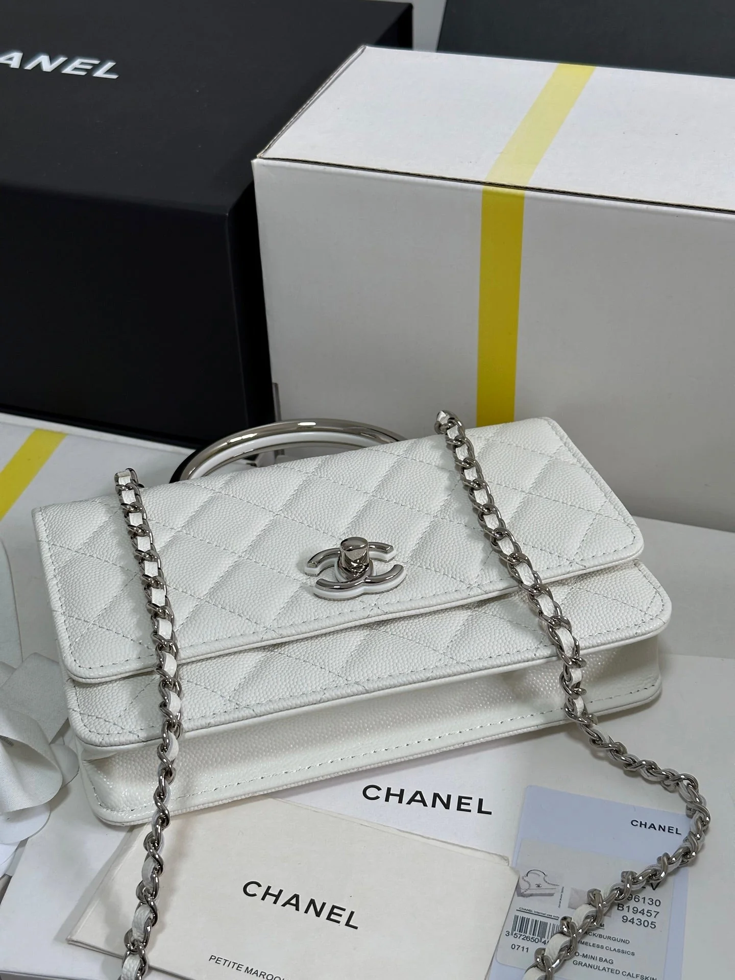 FLAP BAG WITH SILVER-TONE HANDLE 19 IN WHITE CAVIAR SKIN