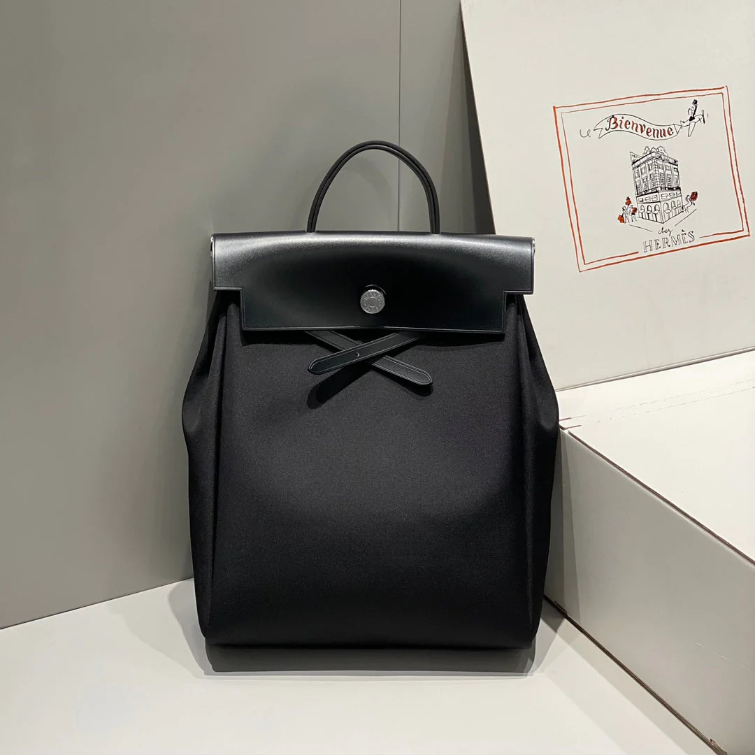 HERBAG A DOS ZIP RETOURNE BACKPACK 29 IN BLACK CANVAS AND CALFSKIN