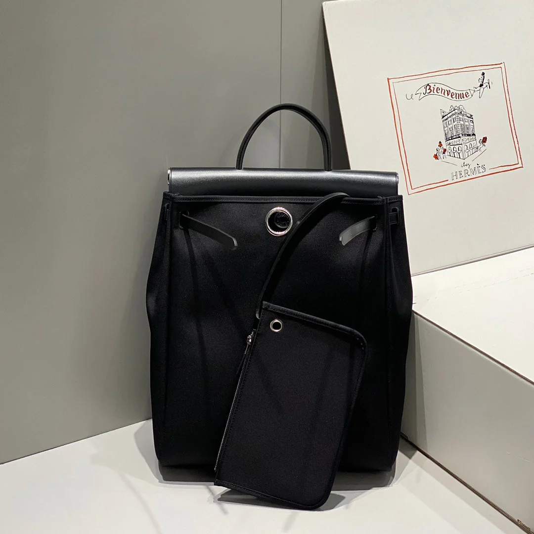 HERBAG A DOS ZIP RETOURNE BACKPACK 29 IN BLACK CANVAS AND CALFSKIN