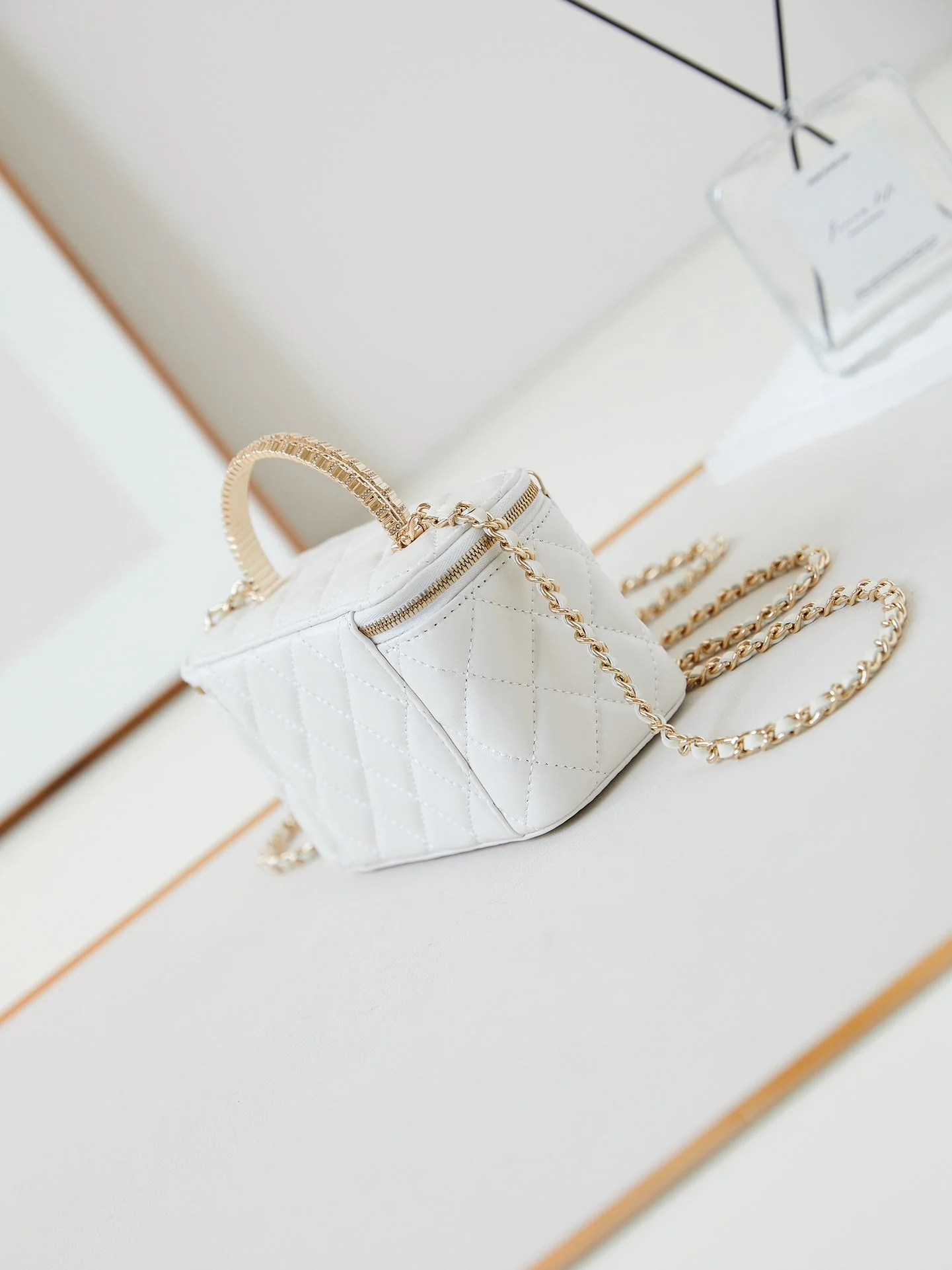 CHANEL 25S MINI VANITY BAG 16 CM IN WHITE LAMBSKIN WITH CRYSTAL-EMBELLISHED CC LOGO