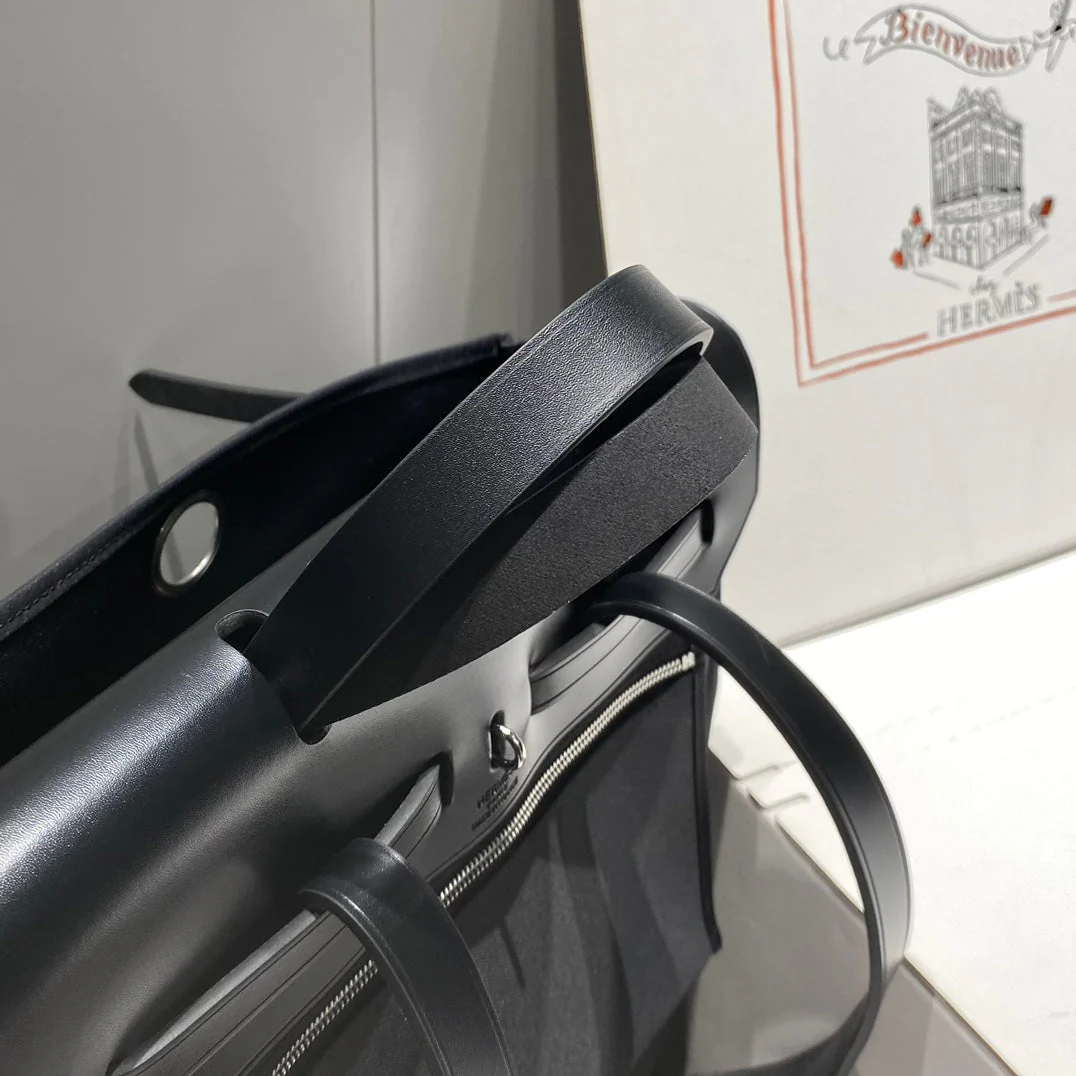 HERBAG A DOS ZIP RETOURNE BACKPACK 29 IN BLACK CANVAS AND CALFSKIN