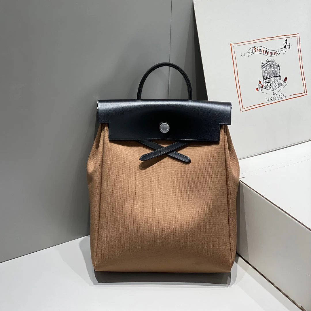 HERBAG A DOS ZIP RETOURNE BACKPACK 29 IN BROWN CANVAS AND BLACK CALFSKIN