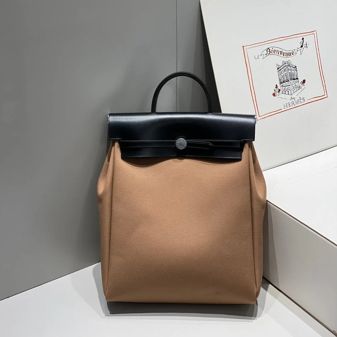 HERBAG A DOS ZIP RETOURNE BACKPACK 29 IN BROWN CANVAS AND BLACK CALFSKIN