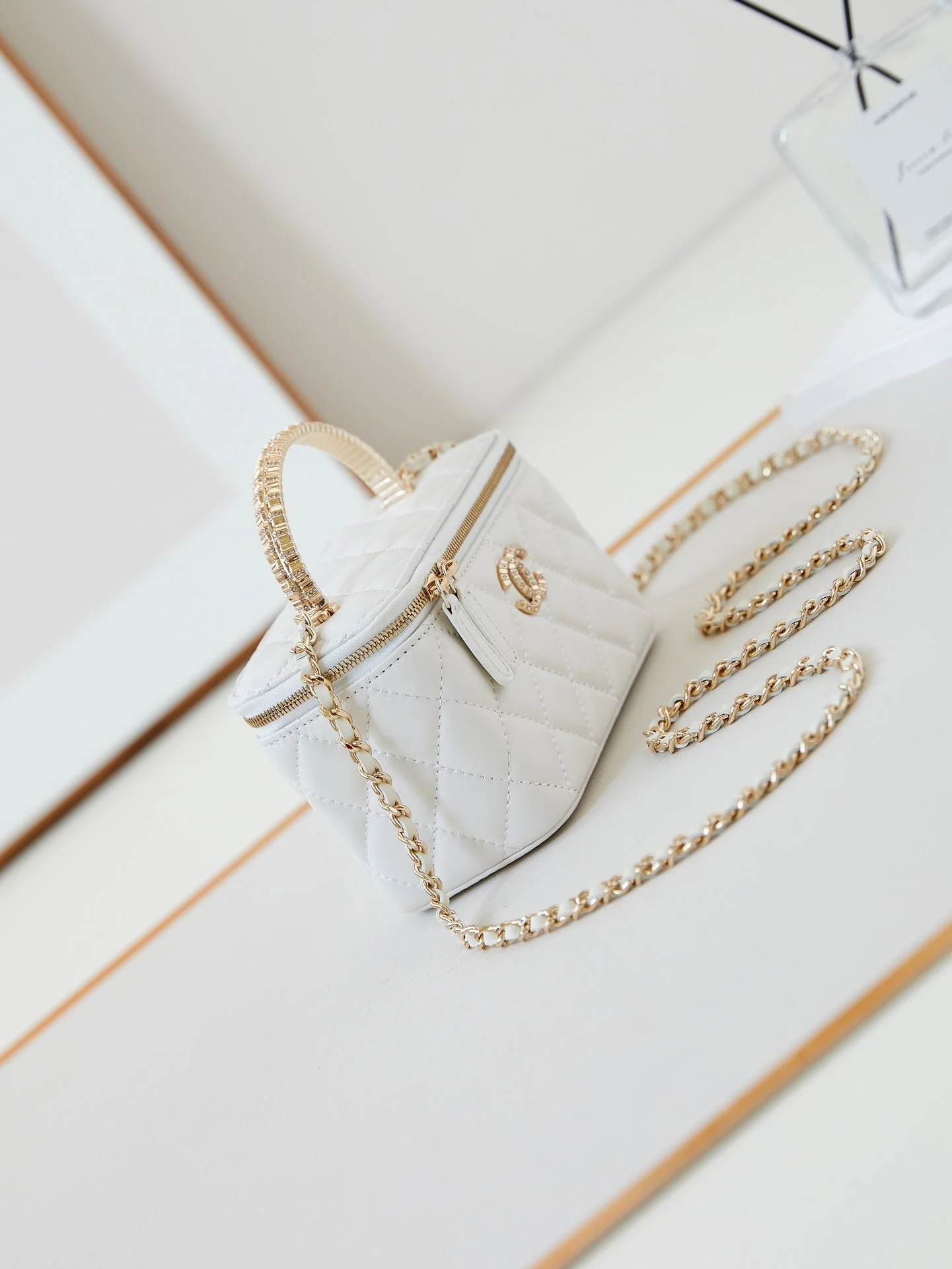 CHANEL 25S MINI VANITY BAG 16 CM IN WHITE LAMBSKIN WITH CRYSTAL-EMBELLISHED CC LOGO