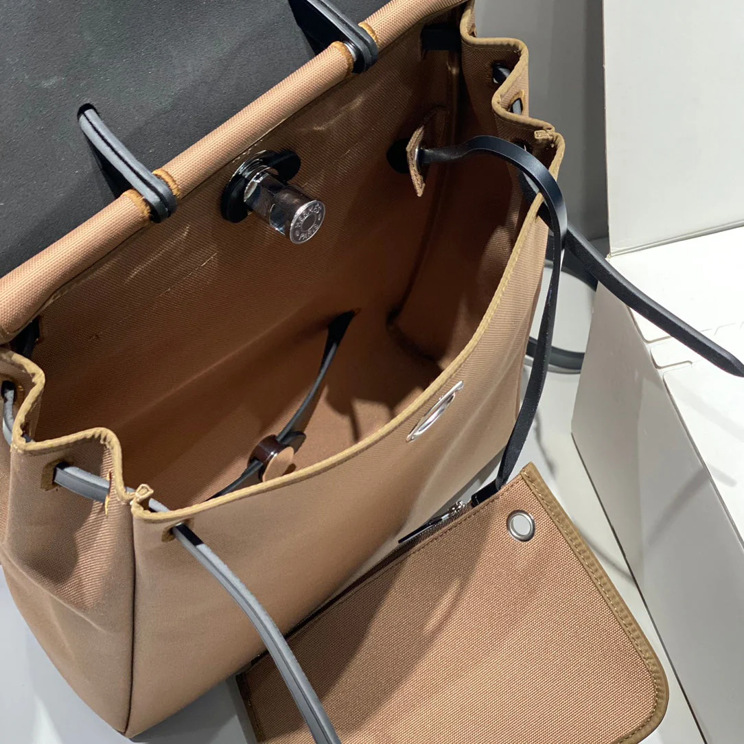 HERBAG A DOS ZIP RETOURNE BACKPACK 29 IN BROWN CANVAS AND BLACK CALFSKIN