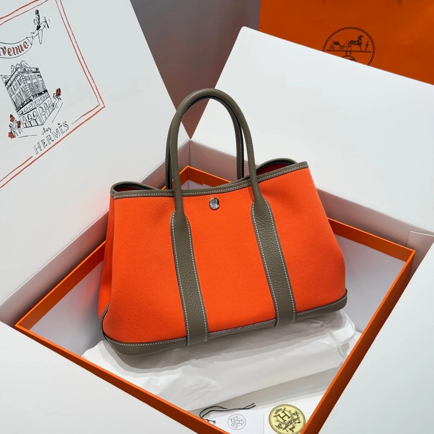GARDEN PARTY 30CM IN ORANGE MINIMUM TOILETS COTTON CANVAS AND BROWN CALFSKIN