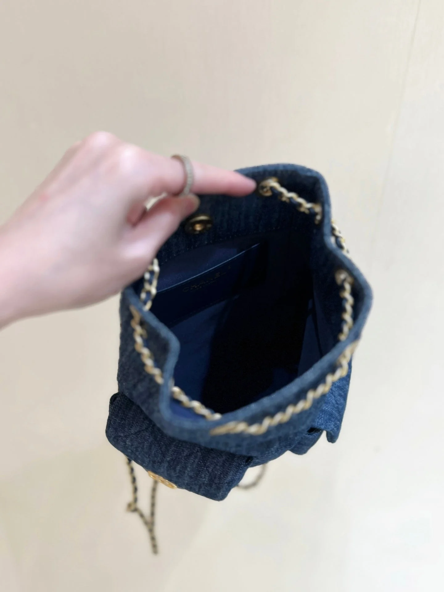 DRAWSTRING BUCKET BACKPACK 24 IN DARK BLUE DENIM GOLD HARDWARE