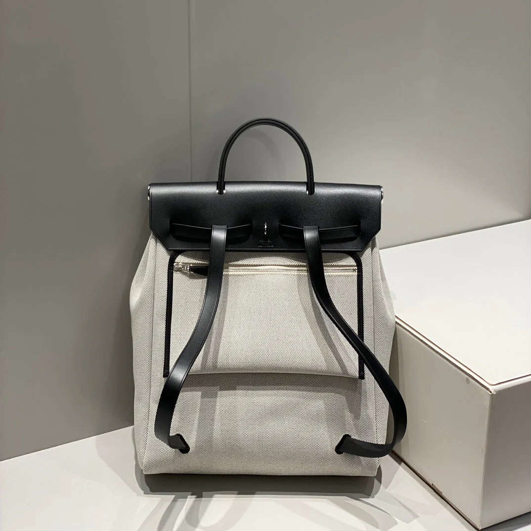 HERBAG A DOS ZIP RETOURNE BACKPACK 29 IN OFF-WHITE CANVAS AND BLACK CALFSKIN