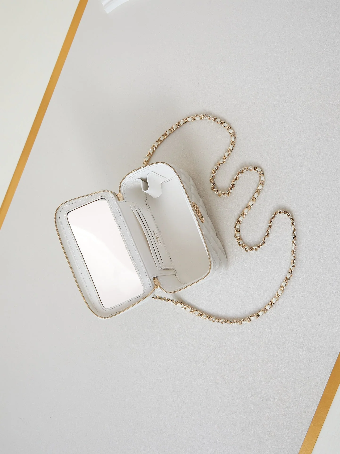 CHANEL 25S MINI VANITY BAG 16 CM IN WHITE LAMBSKIN WITH CRYSTAL-EMBELLISHED CC LOGO