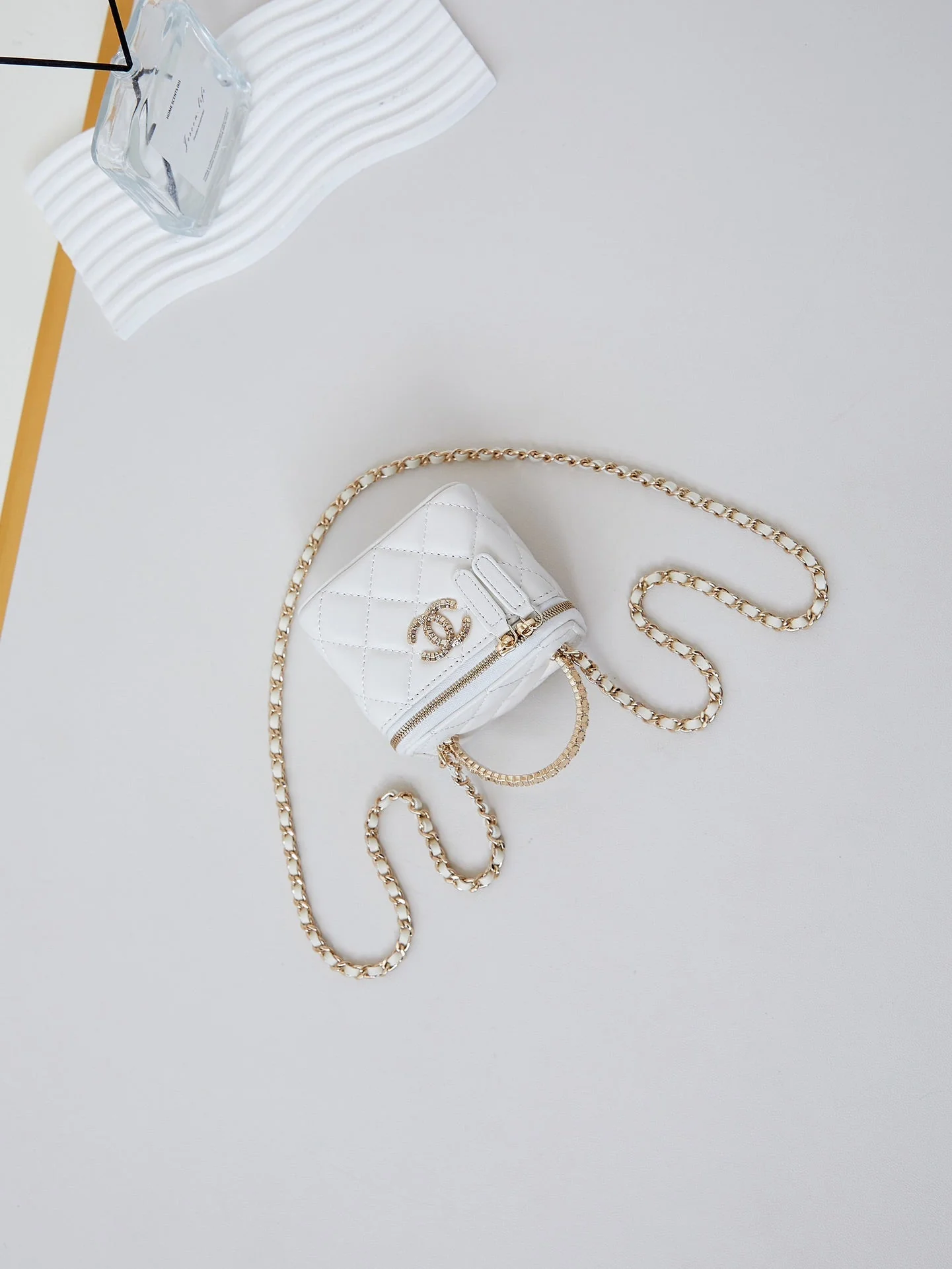 CHANEL 25S MINI VANITY BAG 11 CM IN WHITE LAMBSKIN WITH CRYSTAL-EMBELLISHED CC LOGO