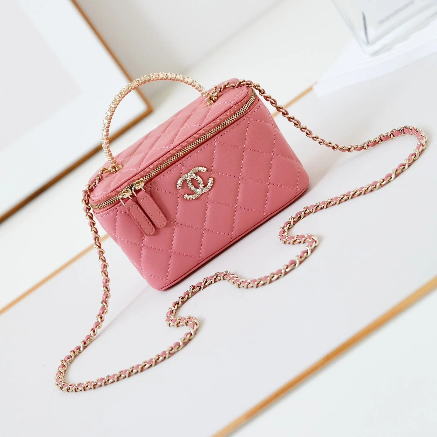 CHANEL 25S MINI VANITY BAG 16 CM IN PEACHY PINK LAMBSKIN WITH CRYSTAL-EMBELLISHED CC LOGO