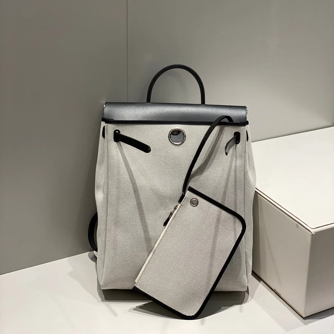 HERBAG A DOS ZIP RETOURNE BACKPACK 29 IN OFF-WHITE CANVAS AND BLACK CALFSKIN