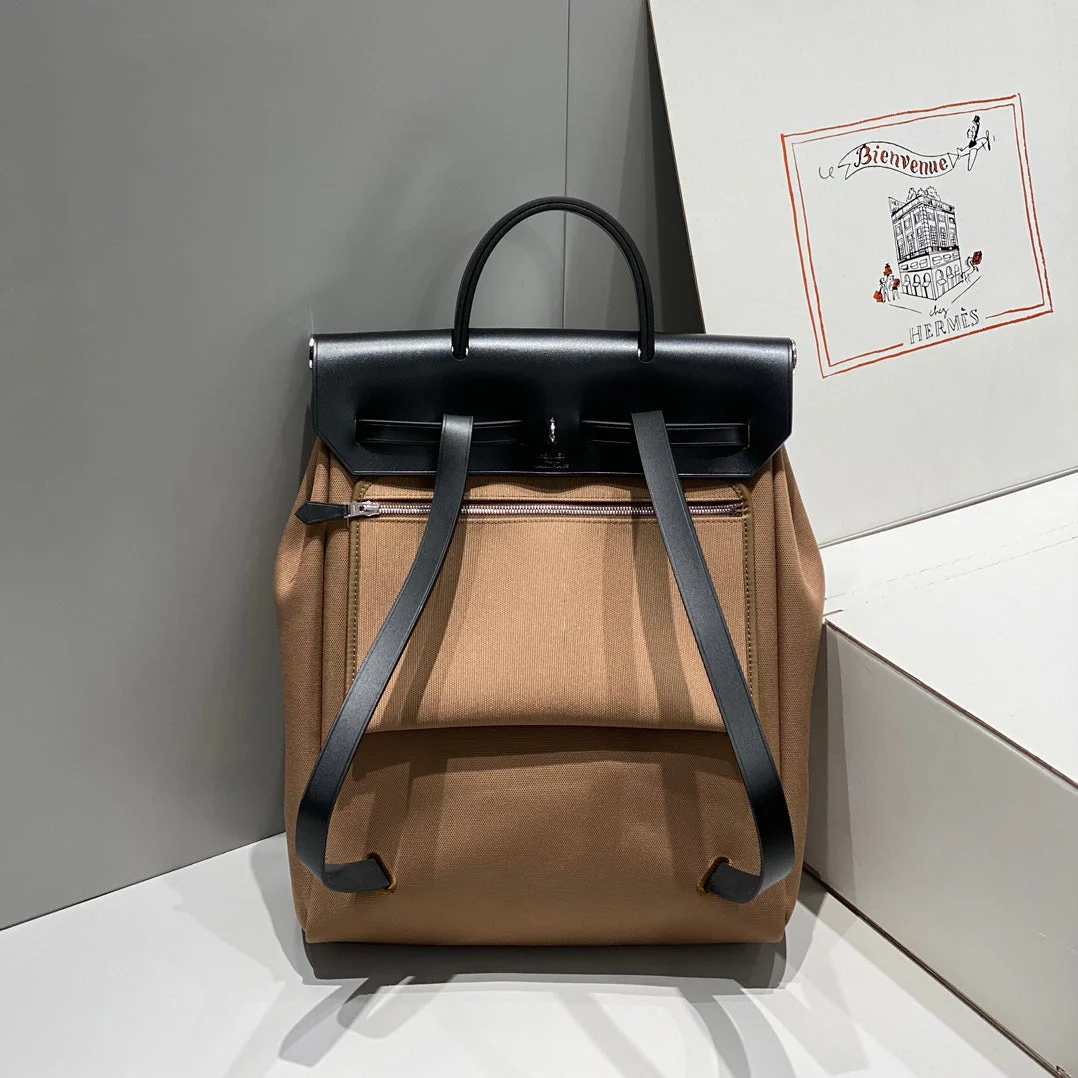 HERBAG A DOS ZIP RETOURNE BACKPACK 29 IN BROWN CANVAS AND BLACK CALFSKIN