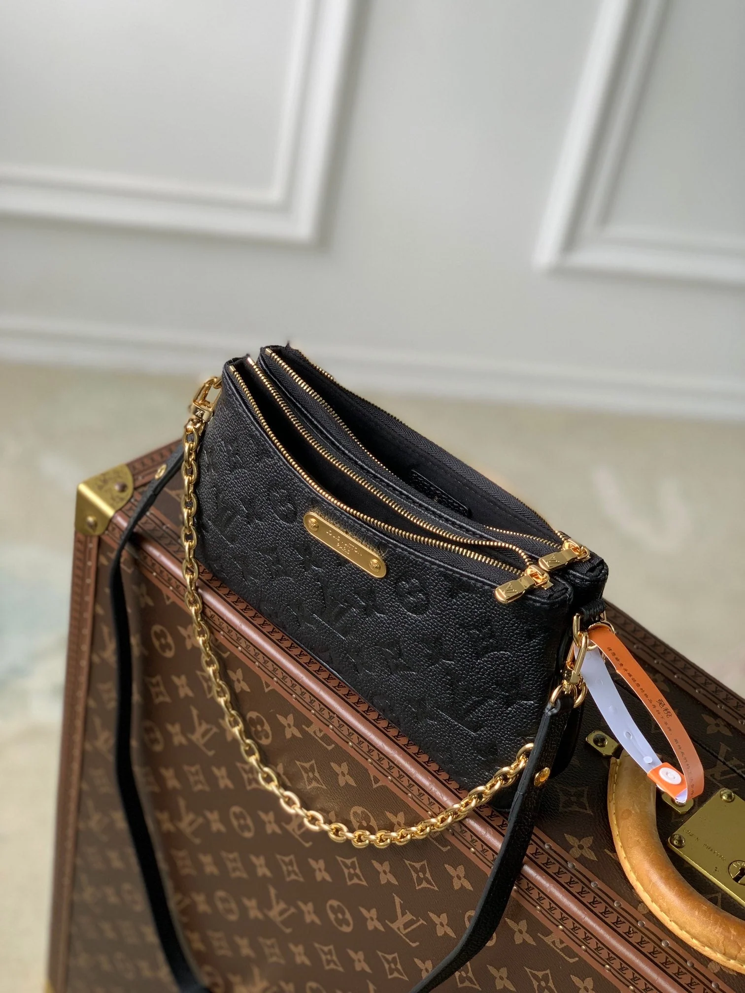 LIV POCHETTE BAG 24 IN BLACK MONOGRAM EMPREINTE LEATHER