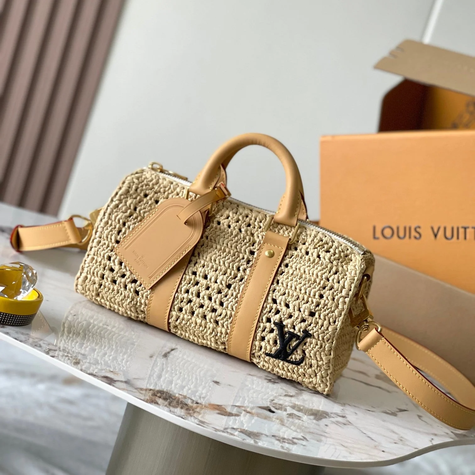 KEEPALL BANDOULIÈRE 25 IN BEIGE CROCHETED RAFFIA AND CALFSKIN TRIM