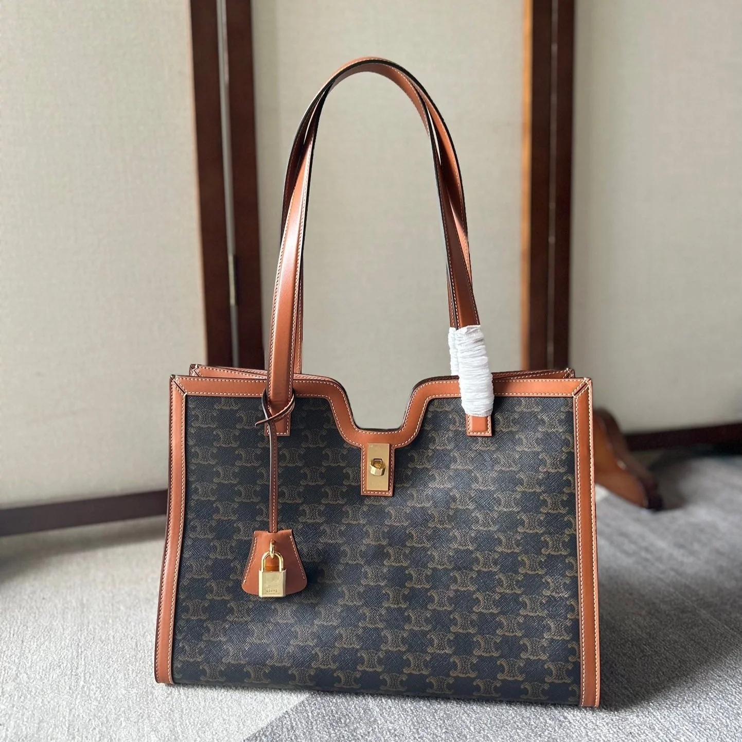 CABAS 37 IN BLACK TRIOMPHE CANVAS AND BRONZE BROWN CALFSKIN TRIM GOLD LOCK