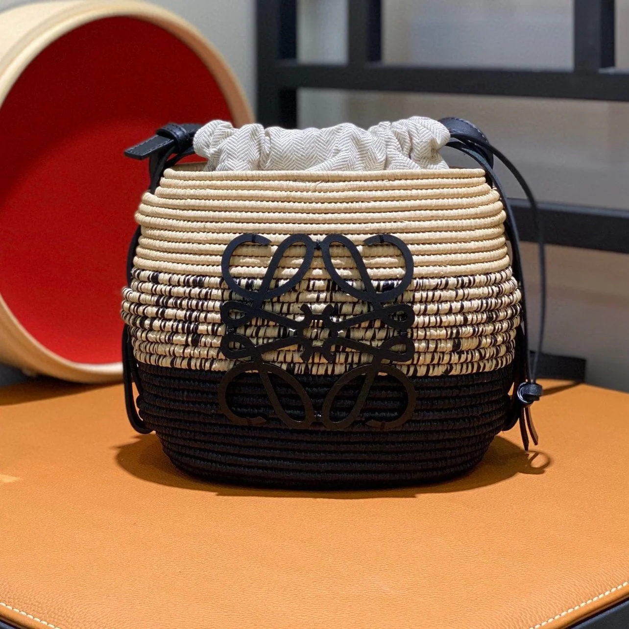 LOE 18 ANAGRAM BASKET BAG IN BLACK AND NATURAL RAFFIA