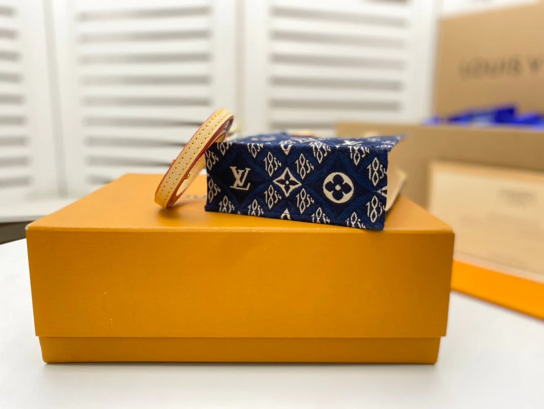 PETIT SAC PLAT BLUE MONOGRAM SINCE 1854 TEXTILE