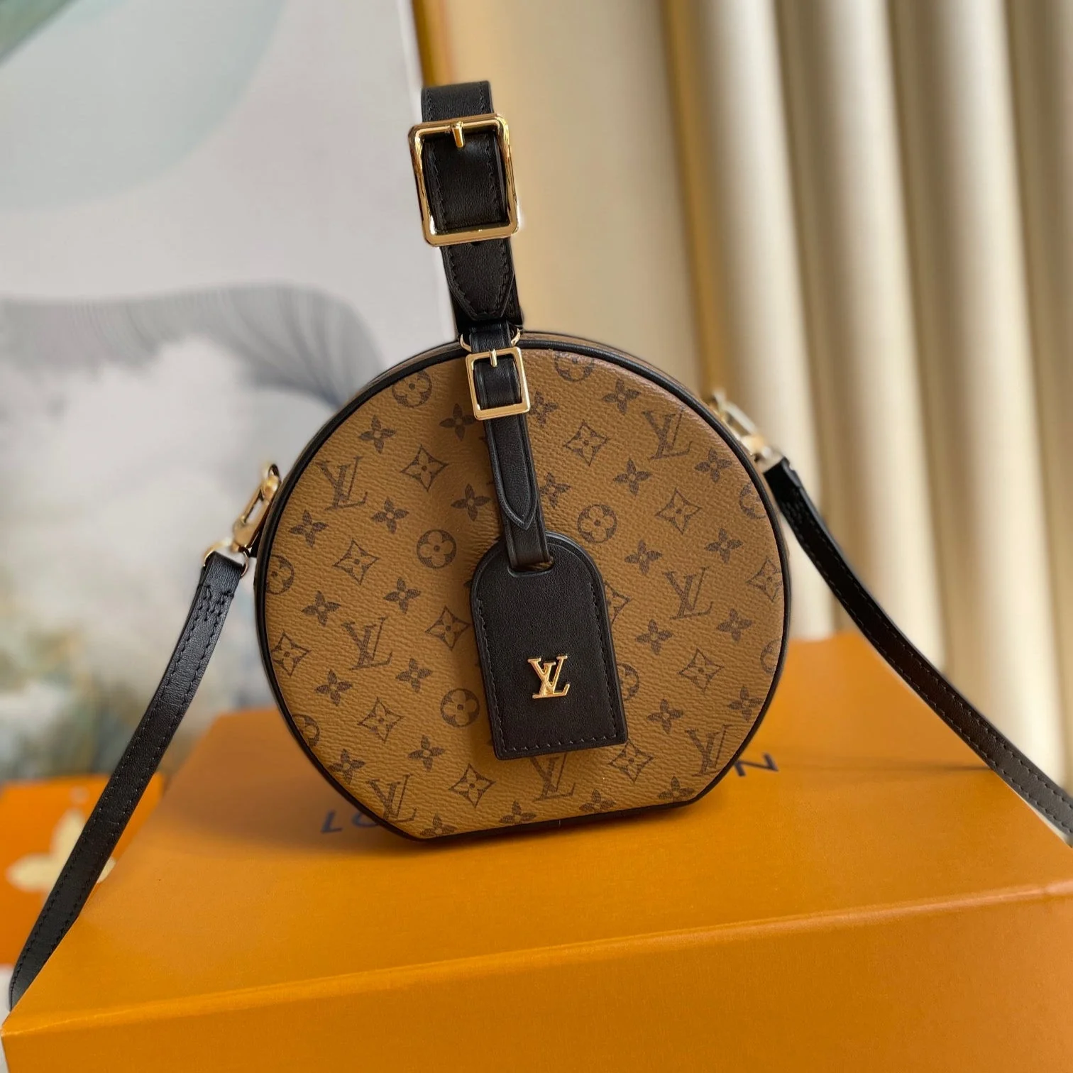 LV 25S PETITE BOITE CHAPEAU 17 IN BLACK MONOGRAM REVERSE CALFSKIN
