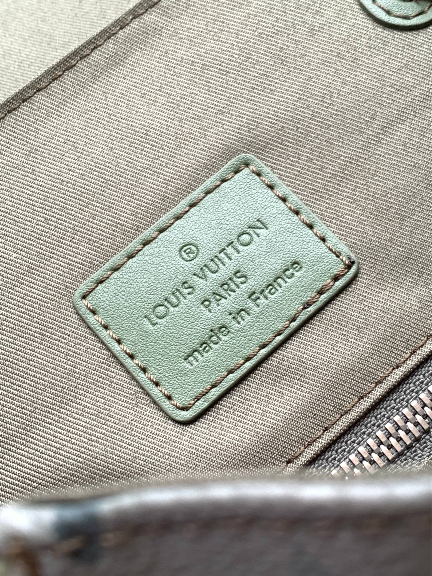 LV 25S CHRISTOPHER BACKPACK 48 IN ARMY GREEN CALFSKIN SILVER HARDWARE