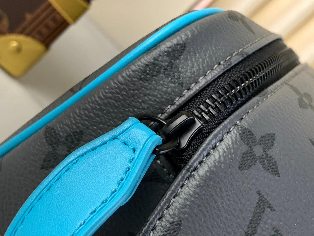 DOPP KIT 28 IN GUN METAL MONOGRAM ECLIPSE CANVAS AND TURQUOISE CALFSKIN TRIM