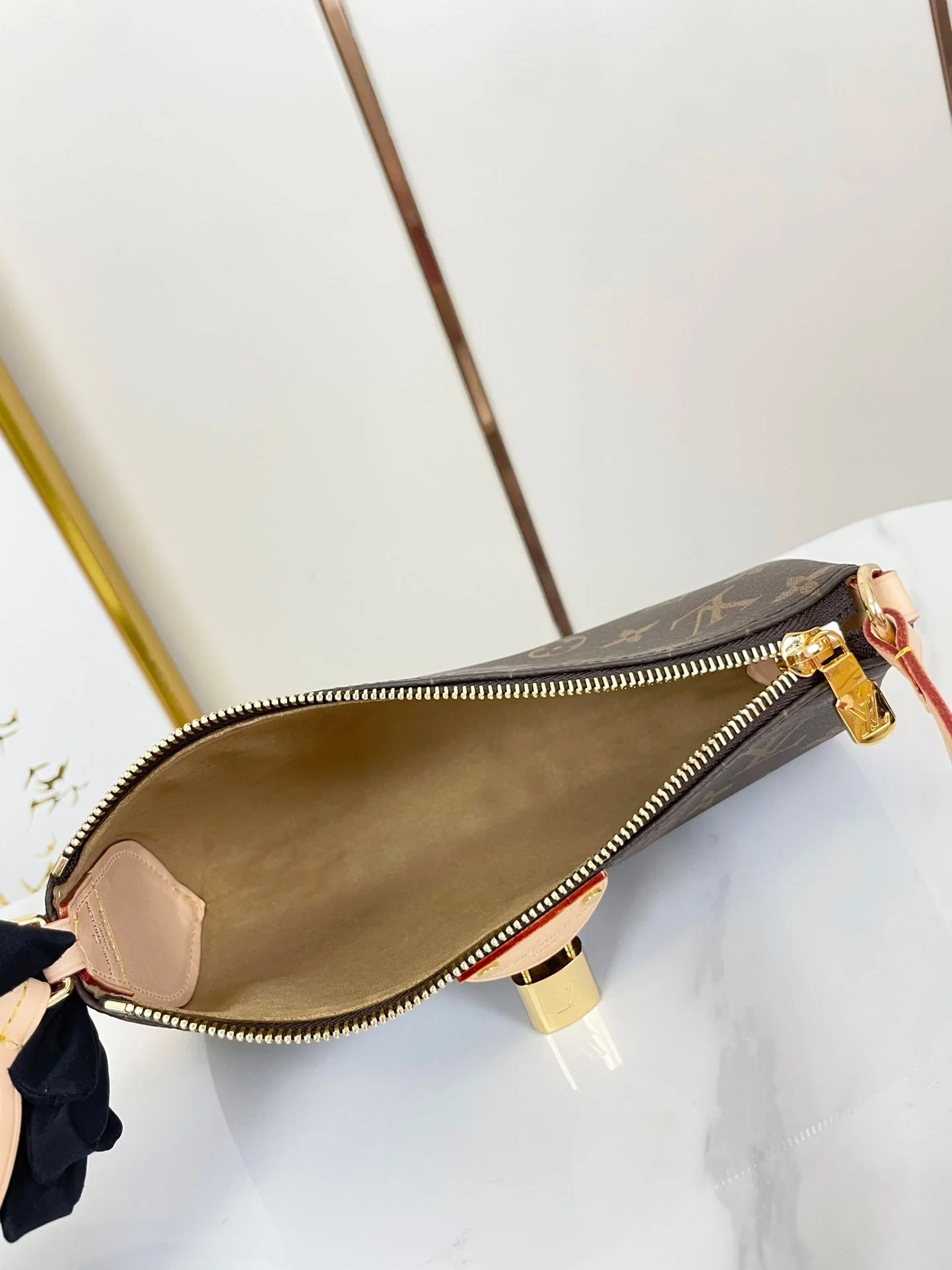 POCHETTE TIRETTE 22 IN BROWN MONOGRAM CANVAS GOLD BUCKLE