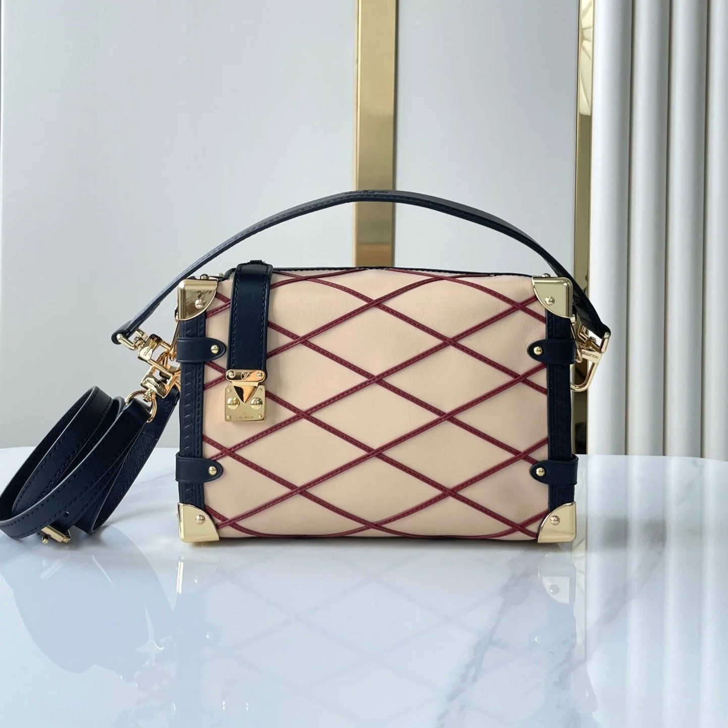 SIDE TRUNK 21 IN BEIGE RED LAMBSKIN WITH CRISS CROSS PATTERN GOLD HARDWARE