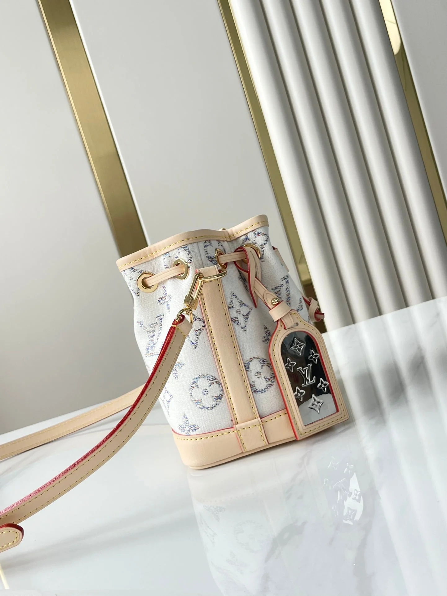 NANO NOÉ 16 IN WHITE MONOGRAM JACQUARD FABRIC AND BEIGE CALFSKIN TRIM
