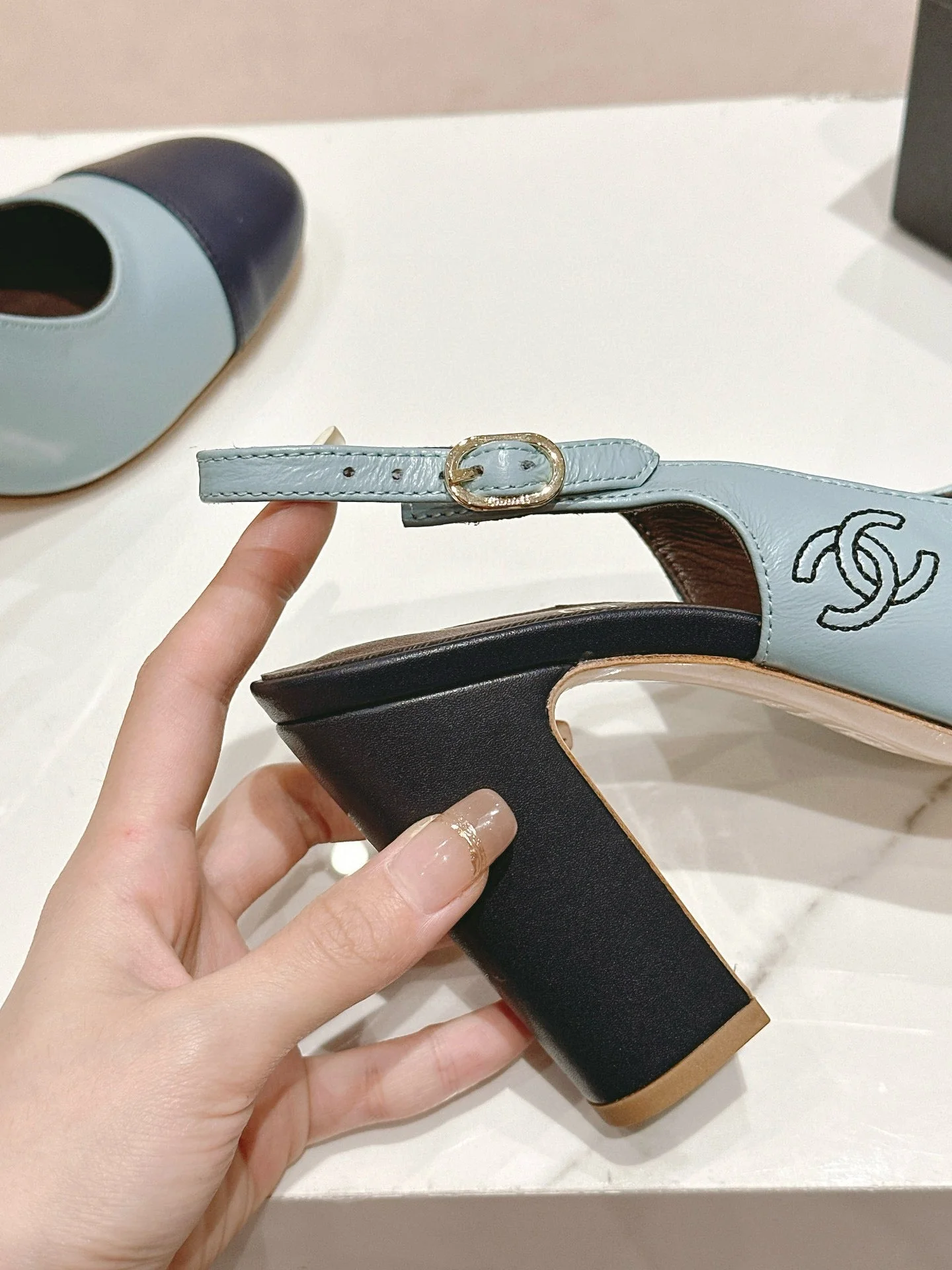 CC SLINGBACK PUMPS IN BLUE AND BLACK CALFSKIN