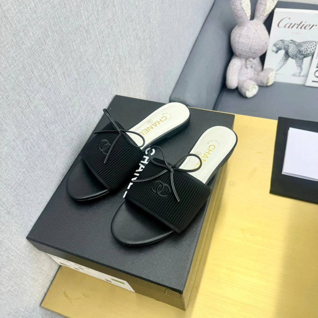 BOW SLIPPERS IN BLACK LAMBSKIN